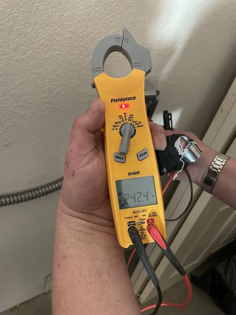 Voltage testing with clamp meter during Electrical Installation Services in St. Paul